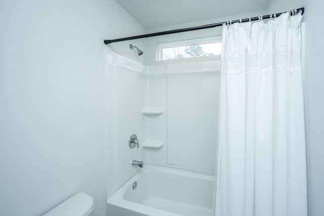 full bath featuring toilet and shower / tub combo with curtain