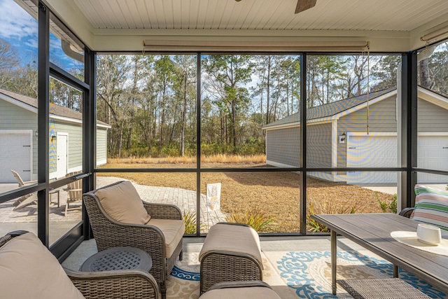 sunroom with ceiling fan and a wealth of natural light