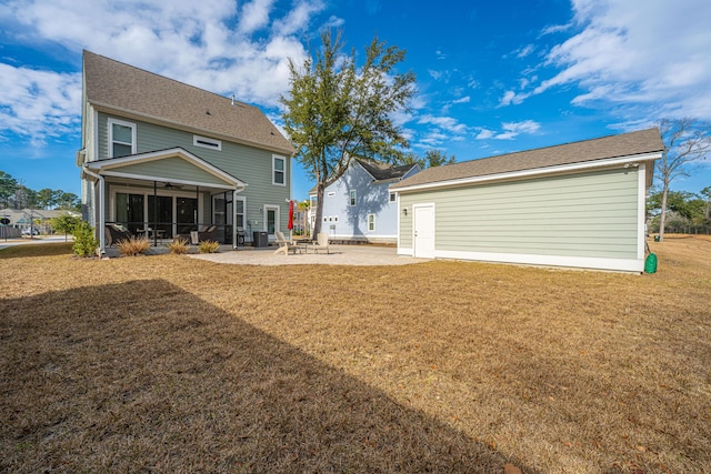 back of property featuring ceiling fan, a yard, a patio area, and a sunroom