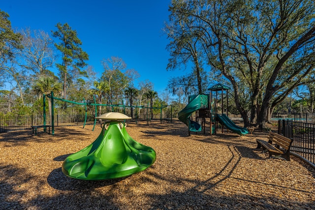 communal playground featuring fence