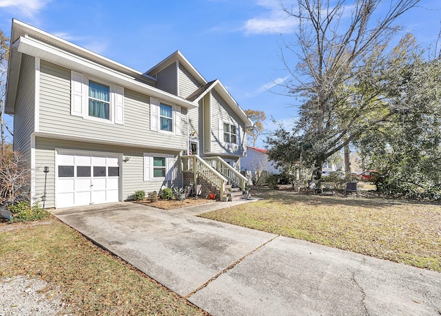 view of front facade with a front yard and a garage