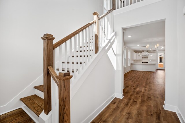 foyer featuring light wood-type flooring and a high ceiling