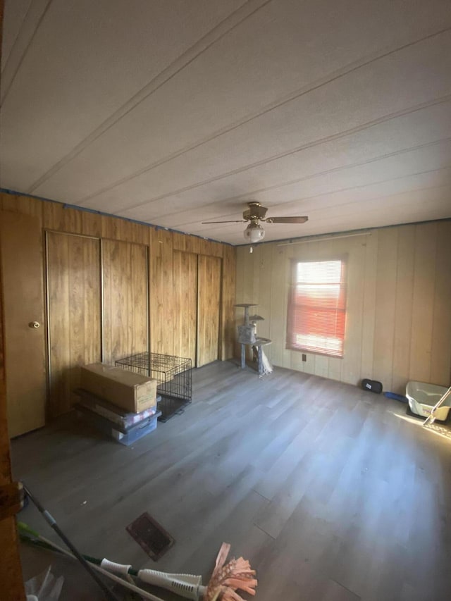 interior space featuring ceiling fan and wood finished floors