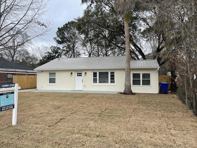 single story home with a patio and a front lawn