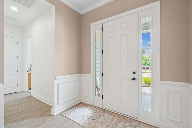 516 Tidewater Chase Ln, Summerville, SC 29486 - foyer entrance with a wainscoted wall, light wood finished floors, and crown molding