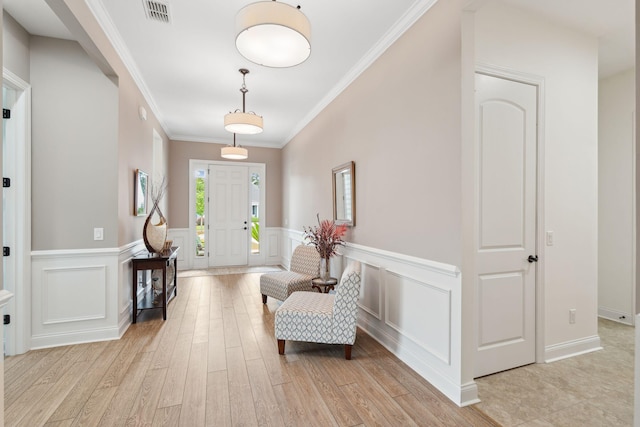 516 Tidewater Chase Ln, Summerville, SC 29486 - foyer featuring a decorative wall, light wood-style flooring, ornamental molding, and a wainscoted wall