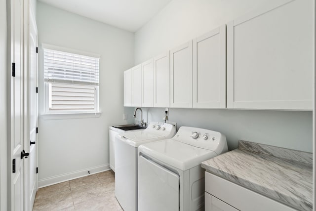 516 Tidewater Chase Ln, Summerville, SC 29486 - washroom featuring cabinet space, washing machine and clothes dryer, baseboards, and light tile patterned flooring