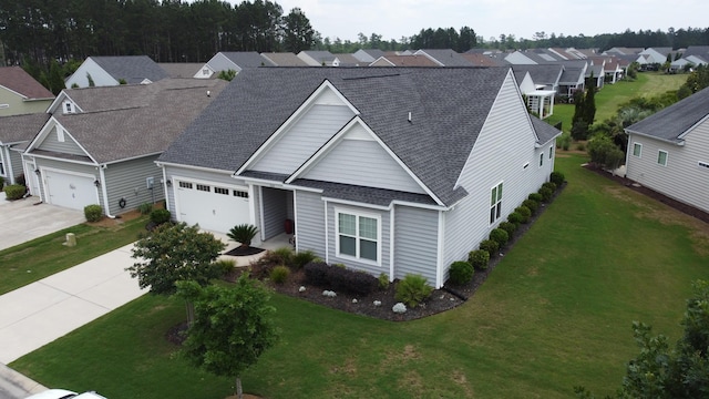 516 Tidewater Chase Ln, Summerville, SC 29486 - traditional home with a garage, a shingled roof, concrete driveway, a residential view, and a front yard