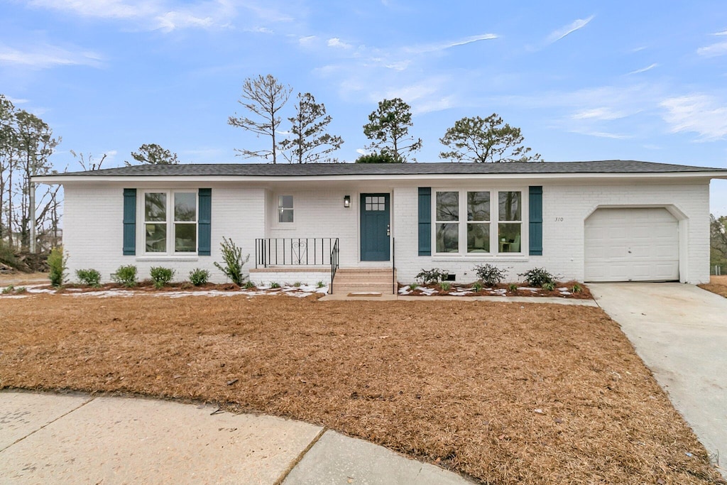 ranch-style house featuring a garage and a porch