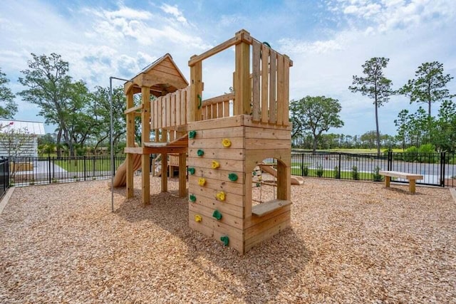 view of playground featuring fence