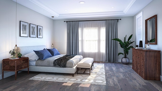 bedroom featuring baseboards, wood finished floors, a tray ceiling, and crown molding