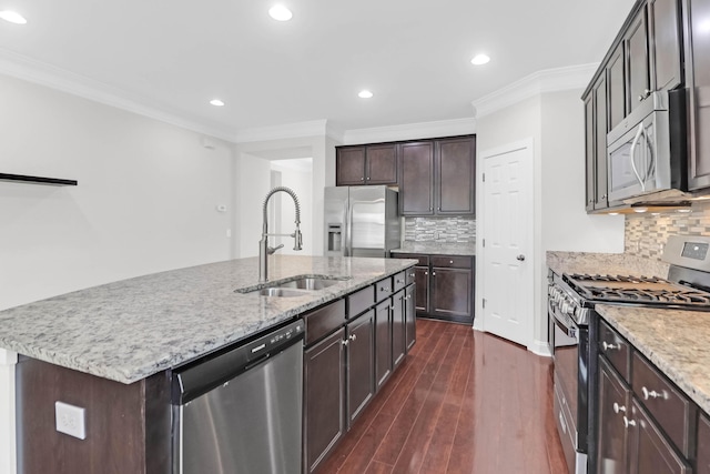 kitchen with stainless steel appliances, a sink, ornamental molding, and dark wood-style floors