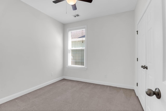 unfurnished bedroom with baseboards, a closet, visible vents, and carpet flooring