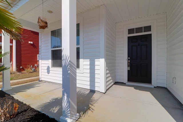 doorway to property featuring covered porch