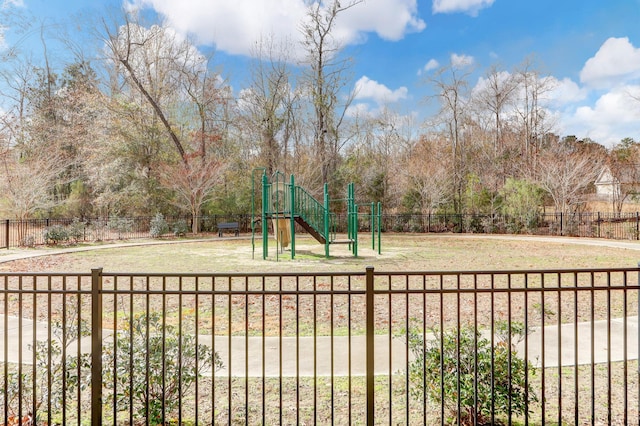 community jungle gym featuring fence