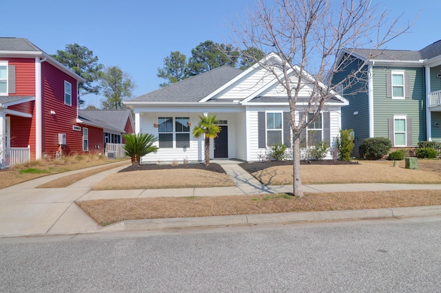 view of front of house with roof with shingles