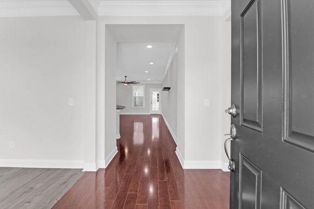 foyer featuring crown molding, recessed lighting, dark wood finished floors, and baseboards