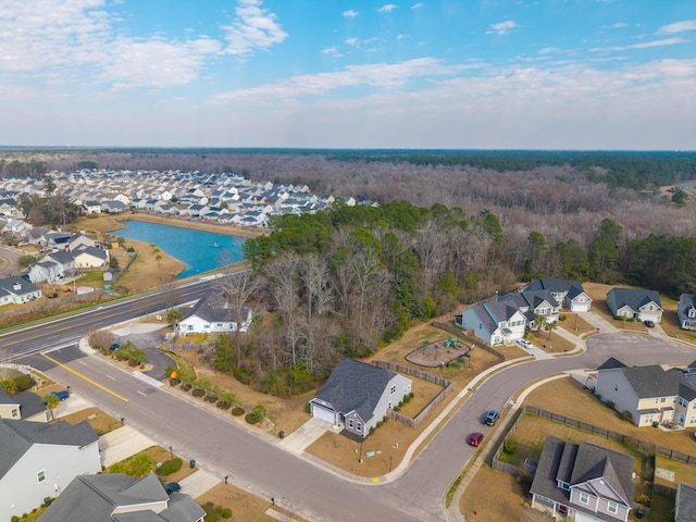 drone / aerial view featuring a water view and a residential view