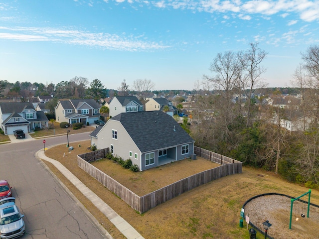 birds eye view of property with a residential view