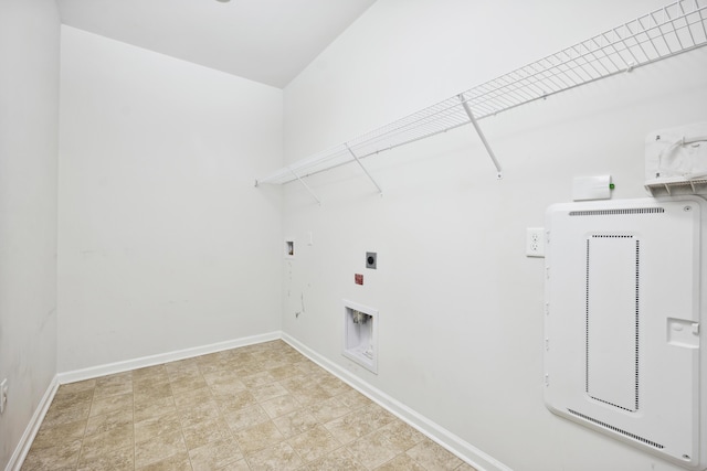 clothes washing area featuring washer hookup, laundry area, electric dryer hookup, and baseboards