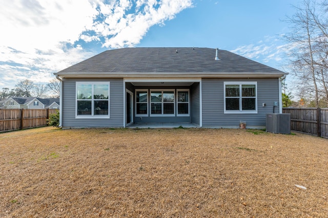 back of house with a patio area, a lawn, fence, and cooling unit