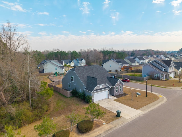 birds eye view of property with a residential view