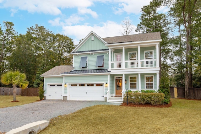 view of front facade featuring a garage, a balcony, and a front lawn