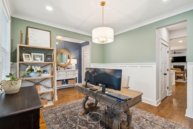 office area with hardwood / wood-style floors, ceiling fan, and ornamental molding