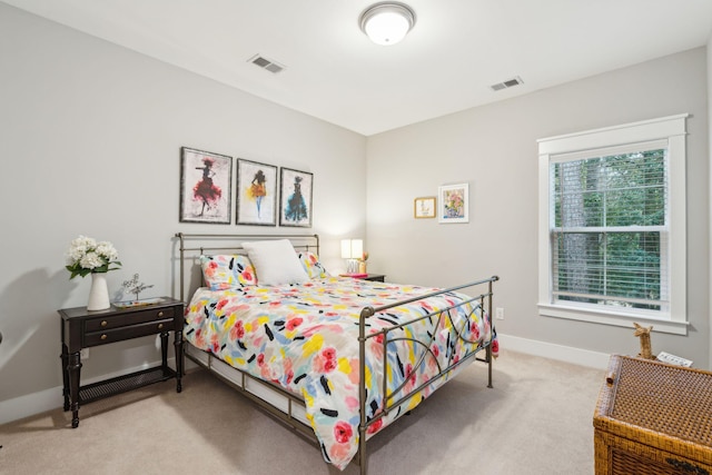 bedroom with light carpet