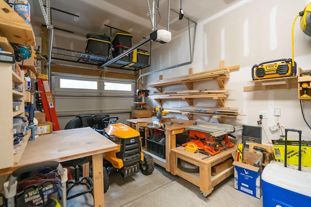 garage featuring a workshop area and a garage door opener