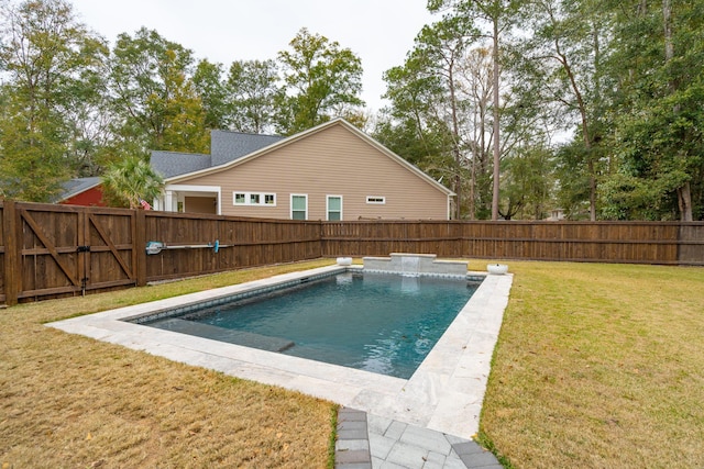 view of pool with a lawn