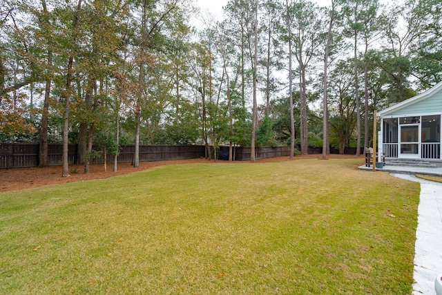 view of yard featuring a sunroom