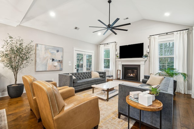 living room featuring ceiling fan, lofted ceiling, and hardwood / wood-style flooring