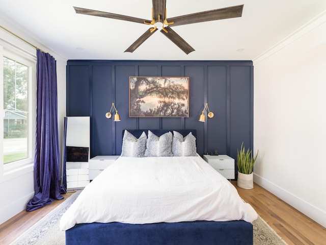 2 Live Oak Ave, Charleston, SC 29407 - bedroom with crown molding, baseboards, a ceiling fan, and wood finished floors