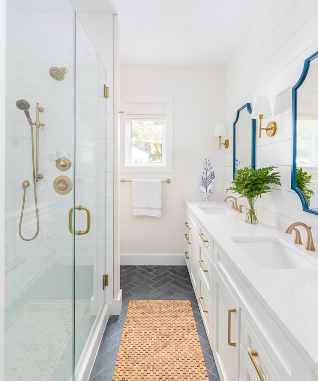 2 Live Oak Ave, Charleston, SC 29407 - bathroom with a stall shower, double vanity, a sink, and baseboards