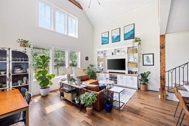 2 Live Oak Ave, Charleston, SC 29407 - living room with high vaulted ceiling, wood finished floors, and stairs