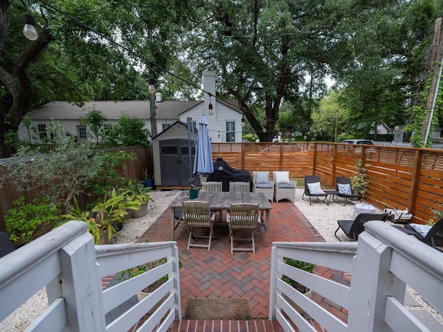 2 Live Oak Ave, Charleston, SC 29407 - view of patio / terrace with an outbuilding, a fenced backyard, outdoor lounge area, and a shed