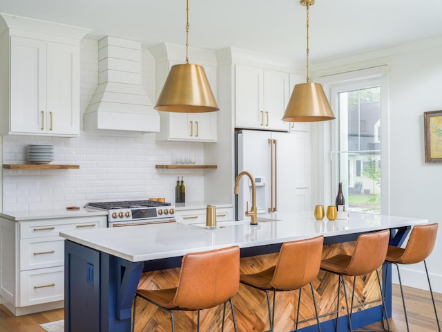 2 Live Oak Ave, Charleston, SC 29407 - kitchen featuring premium range hood, open shelves, high end appliances, decorative backsplash, and a sink