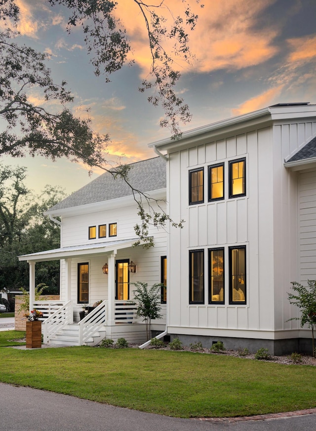 2 Live Oak Ave, Charleston, SC 29407 - modern farmhouse featuring a porch, board and batten siding, and a lawn