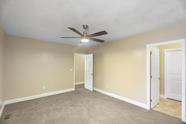 unfurnished bedroom with light carpet and ceiling fan