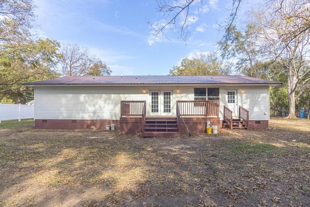 rear view of house with a wooden deck