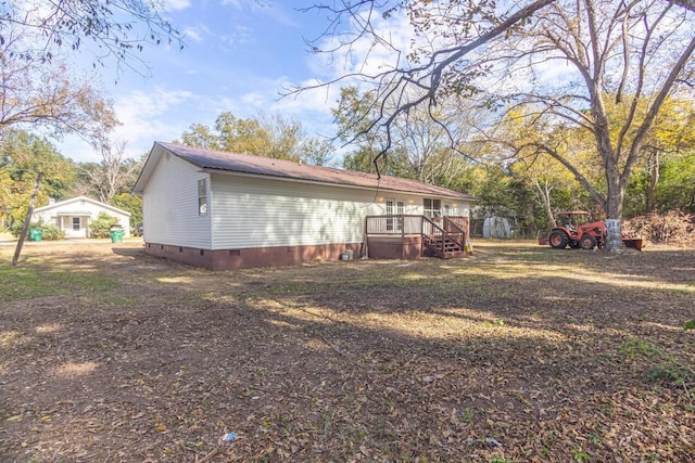 view of yard with a deck