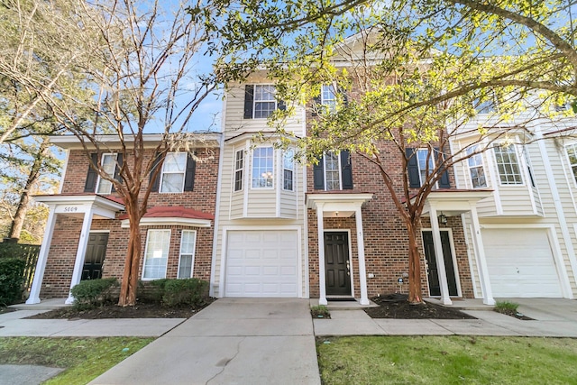 townhome / multi-family property featuring a garage