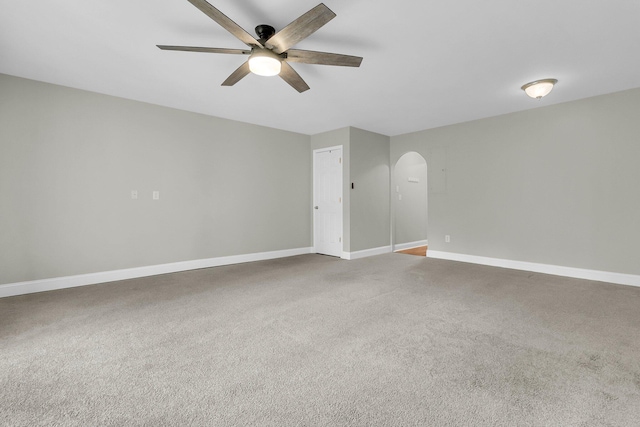 unfurnished room with ceiling fan and carpet floors