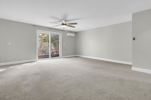 spare room with ceiling fan, carpet floors, and an AC wall unit