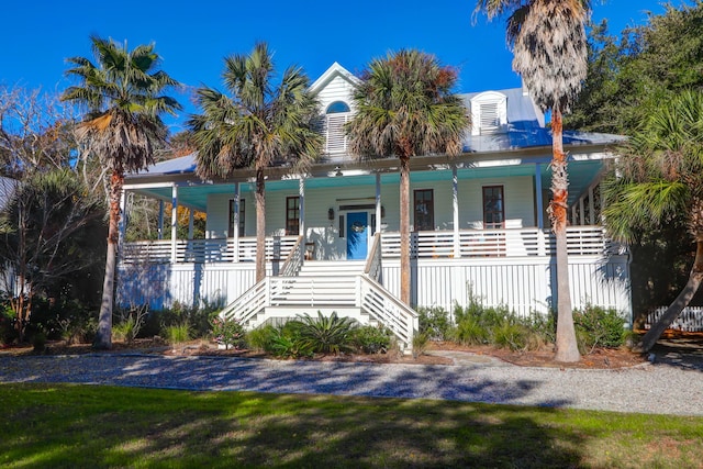 view of front of property featuring stairs and a porch