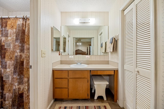 8204 Pleasant Ridge Dr, Charleston, SC 29420 - full bathroom with wallpapered walls, vanity, a textured ceiling, a closet, and a shower with shower curtain