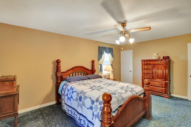 carpeted bedroom featuring a textured ceiling and ceiling fan