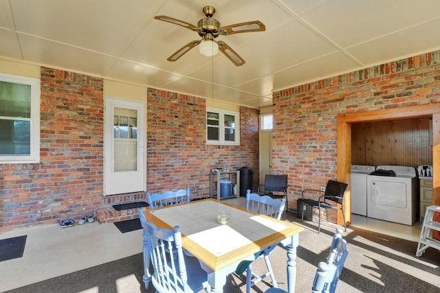 view of patio featuring washing machine and dryer and ceiling fan