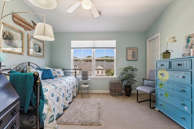 carpeted bedroom featuring vaulted ceiling, ceiling fan, and baseboards